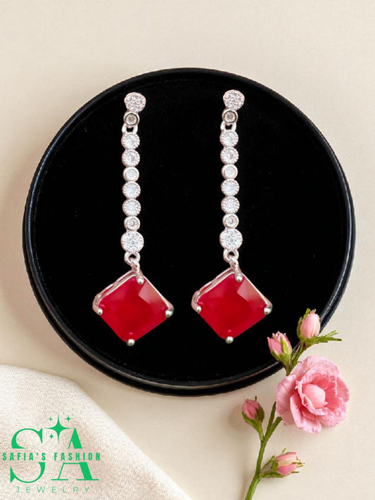 Silver nag earrings with red stones